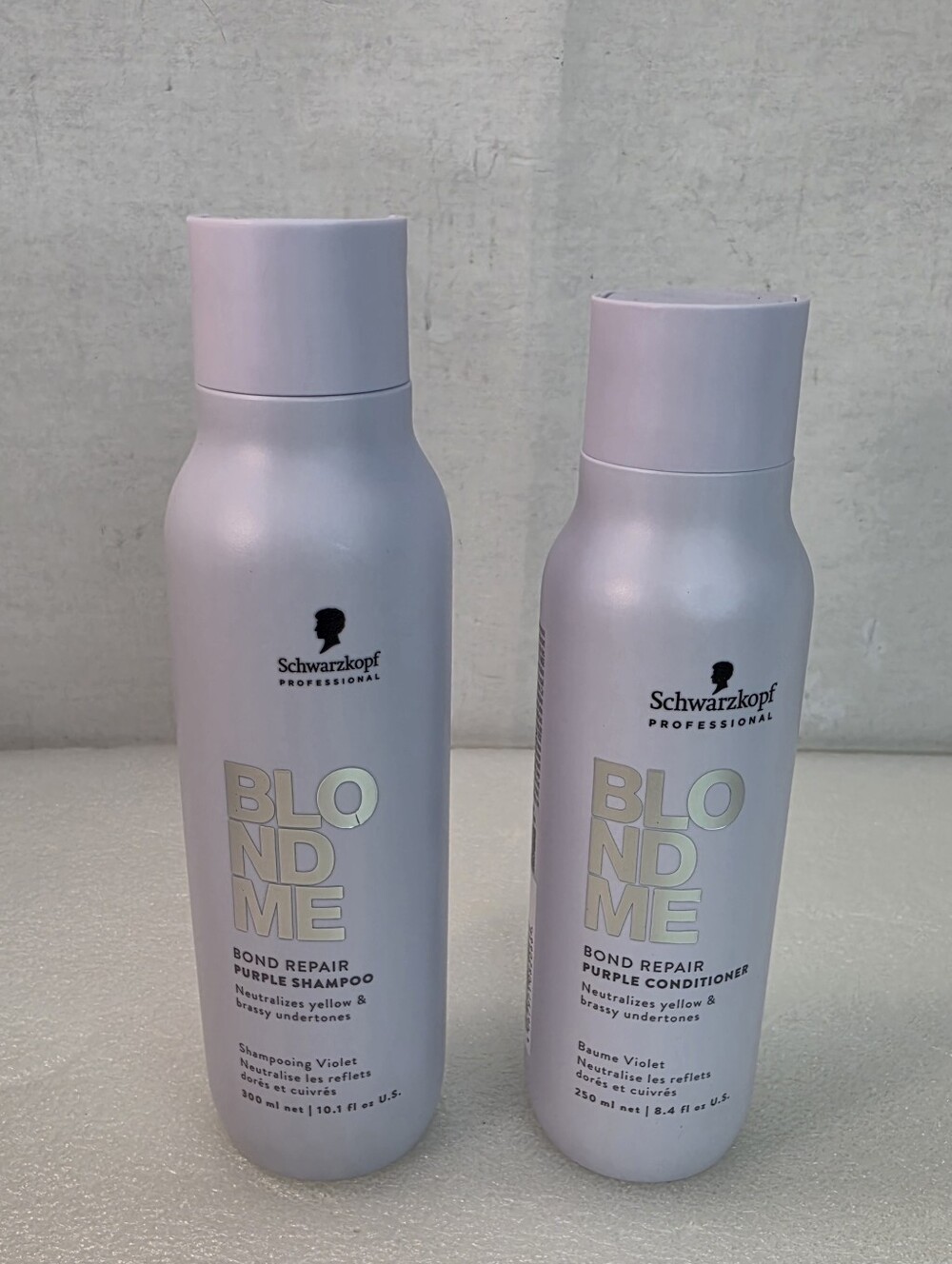 Schwarzkopf BlondMe Bond Repair Purple Shampoo & Bond Purple Conditioner.